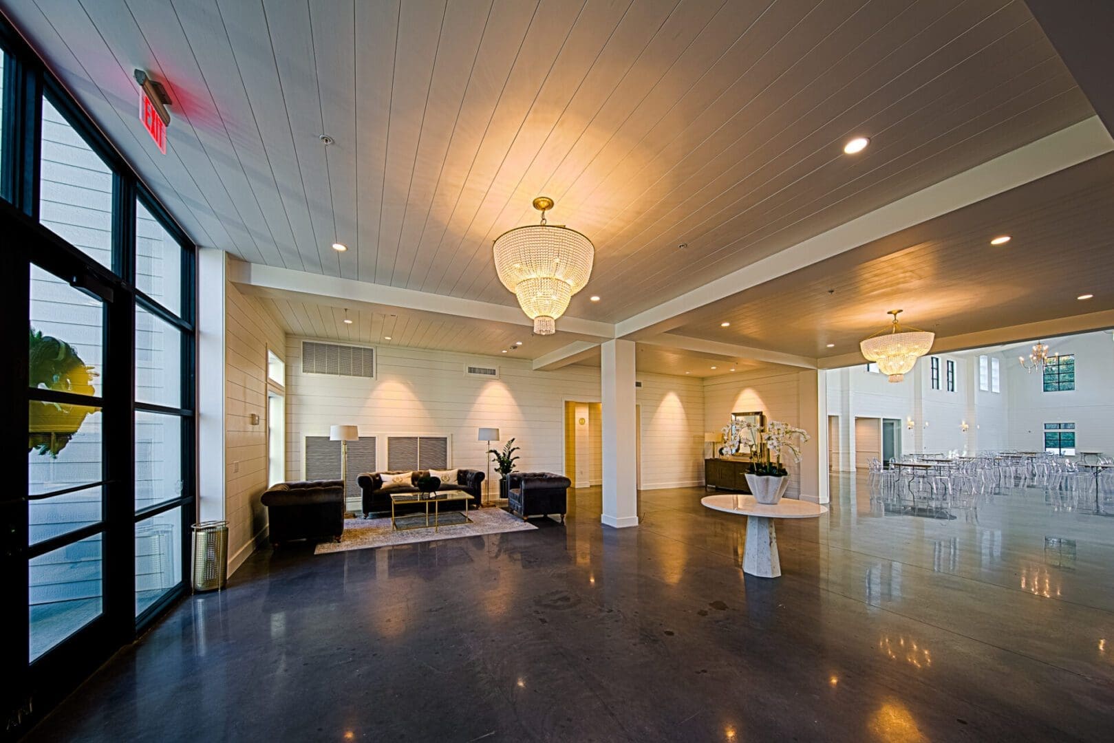 Spacious modern lobby with elegant chandeliers.