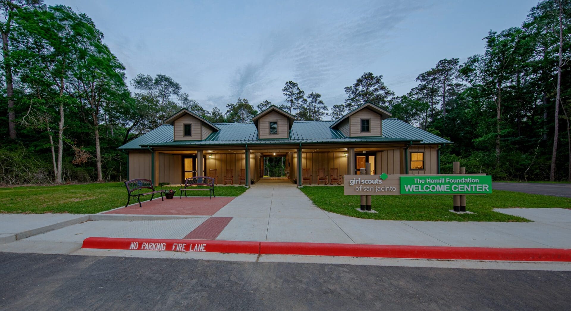 Welcome center building surrounded by trees.