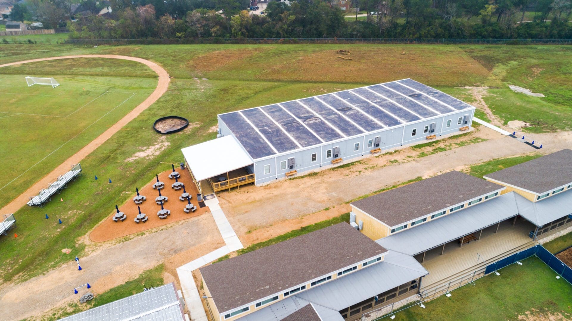 Schoolyard with buildings and sports field aerial.