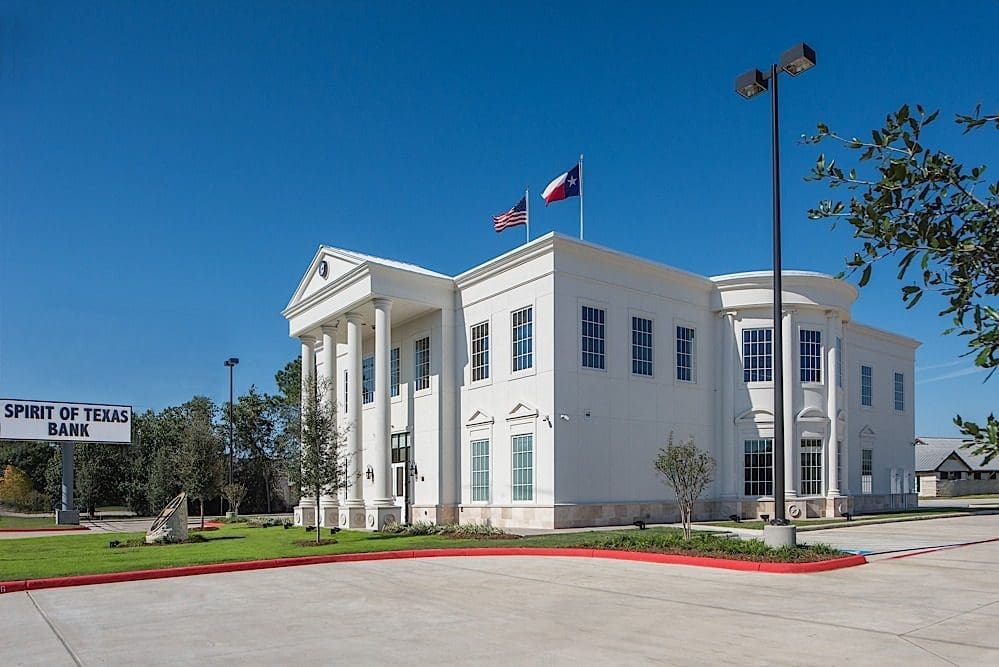 White building with flags, Spirit of Texas.