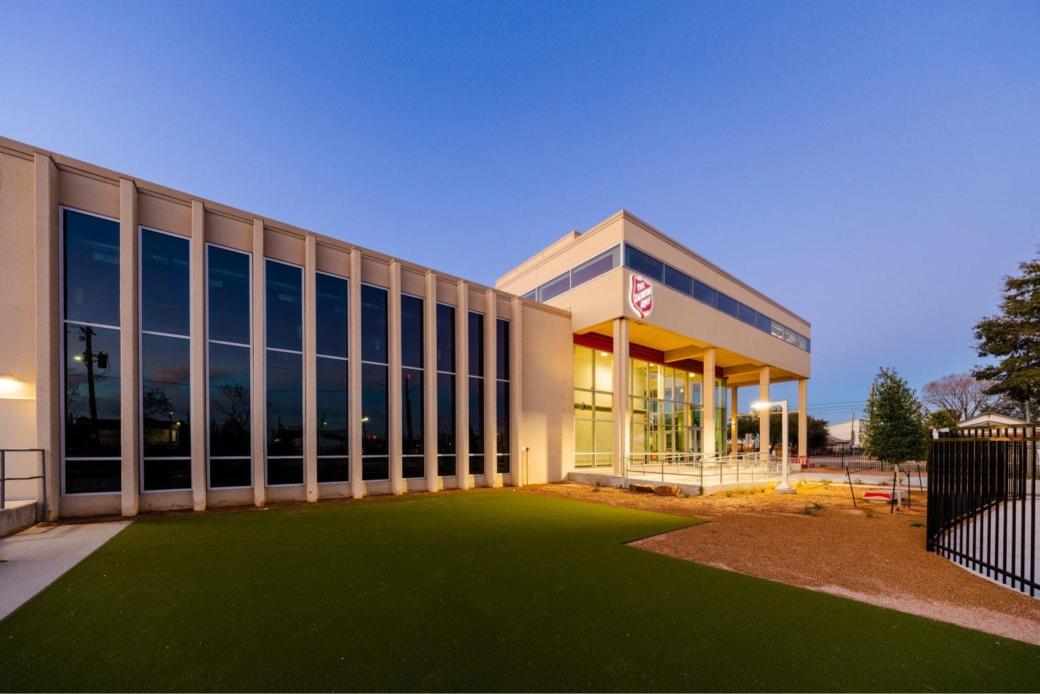 Modern building exterior with large windows.