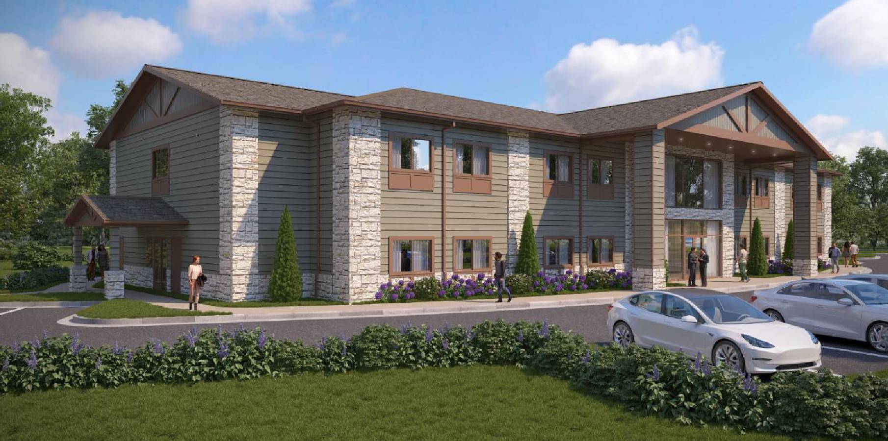 Modern building with parked cars and greenery.