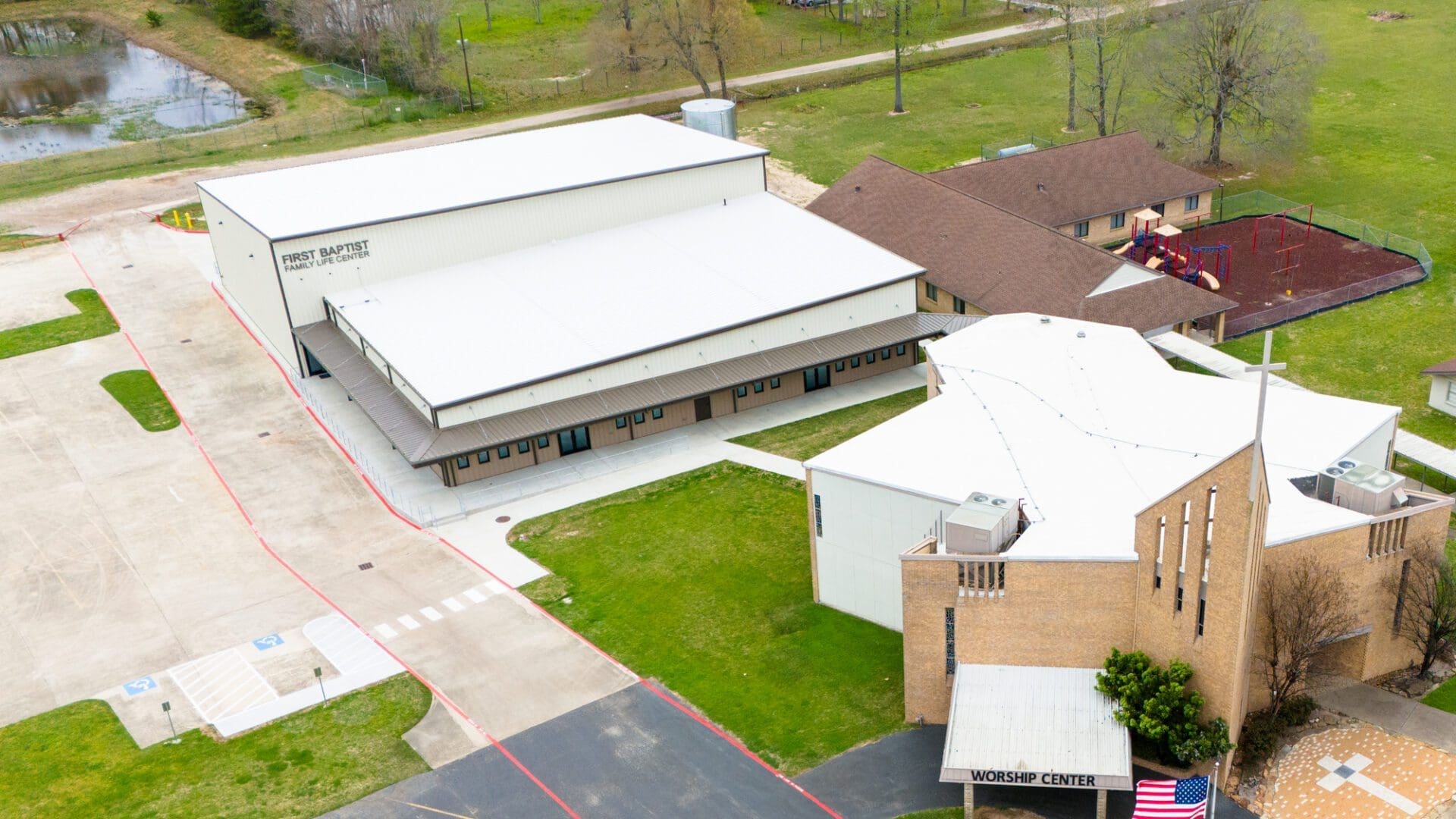 Aerial view of church buildings and surroundings.
