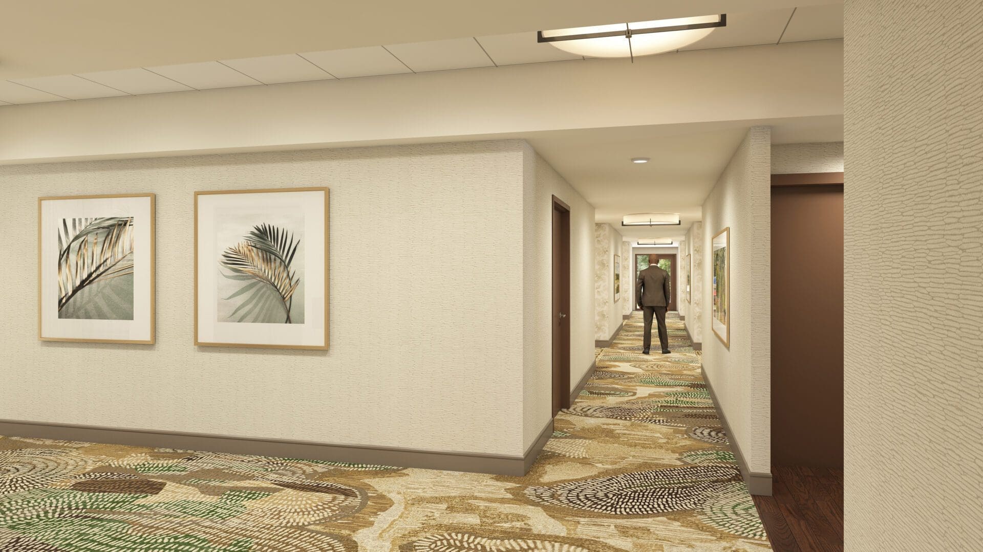 Hotel hallway with patterned carpet and artwork.