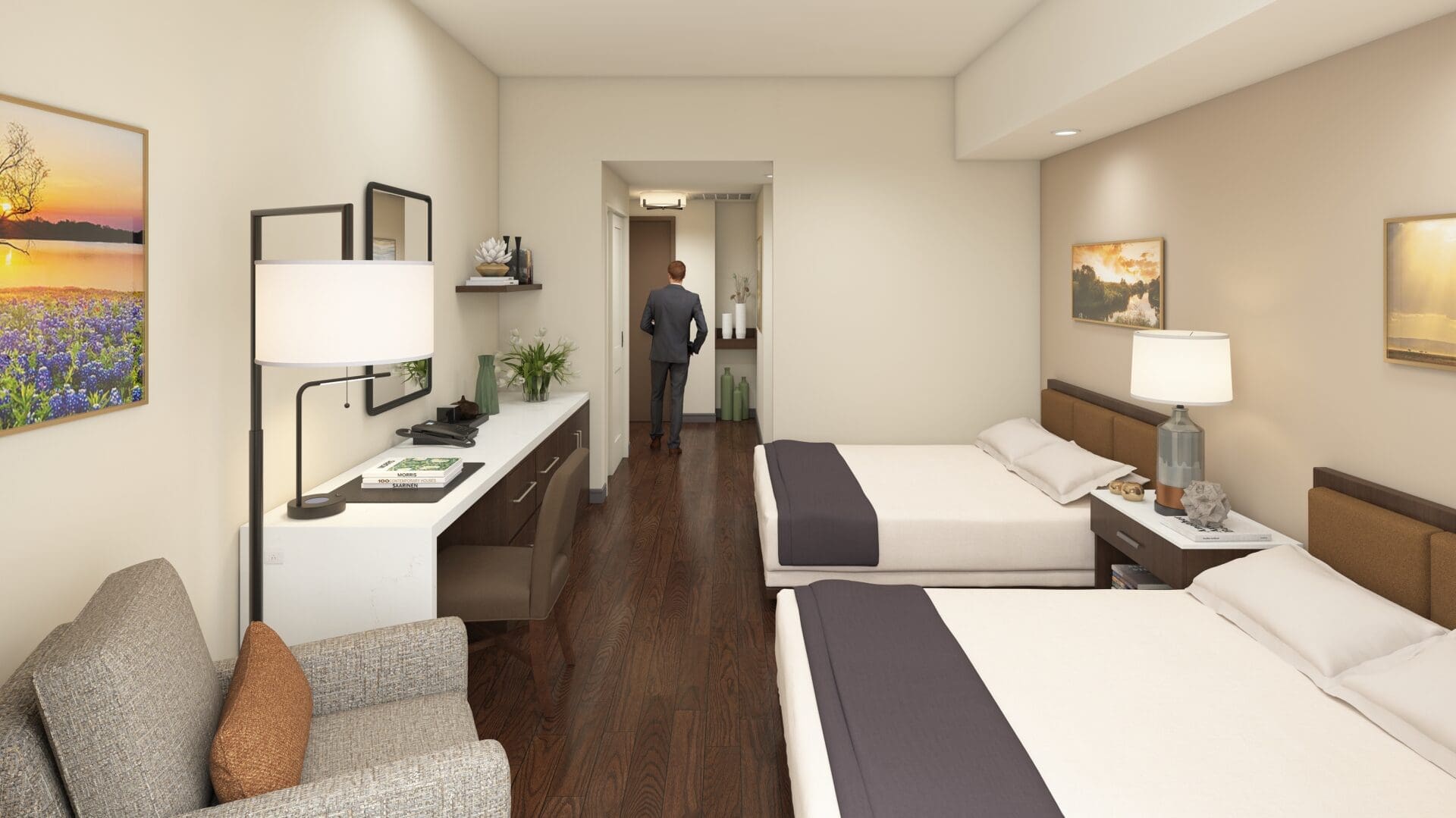 Hotel room with two beds and desk.