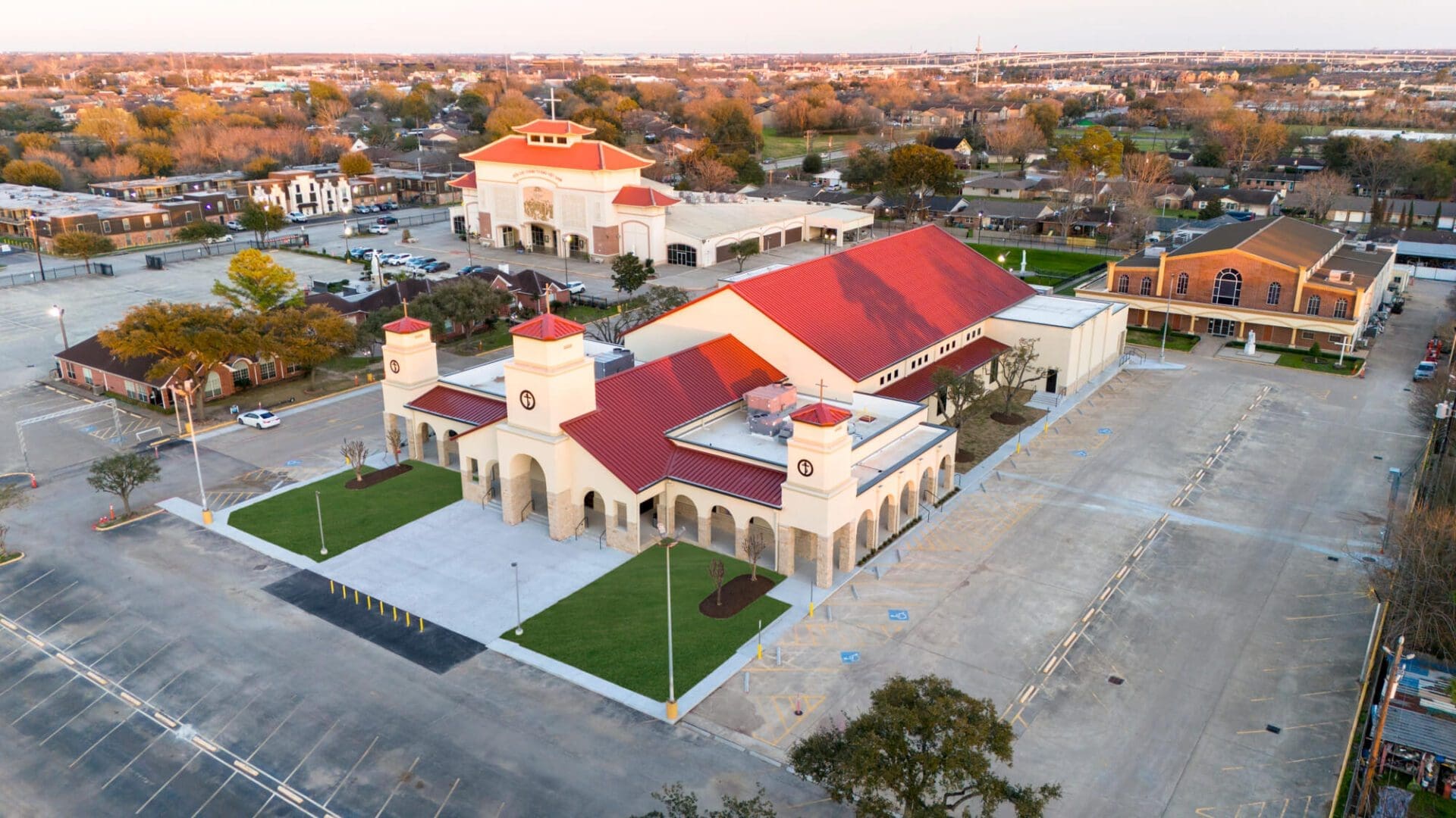 Aerial view of large church campus building.