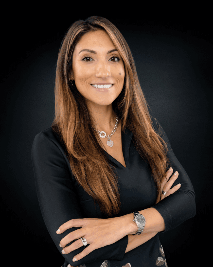 Smiling woman with long hair, black shirt.